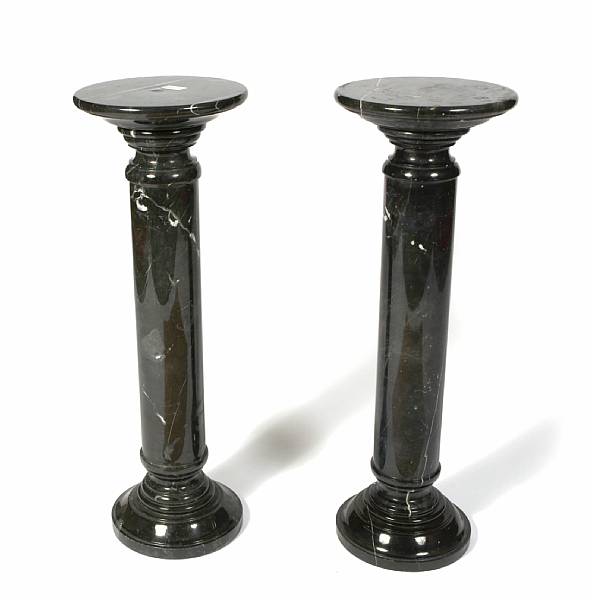 Appraisal: A pair of black marble pedestals height in diameter in