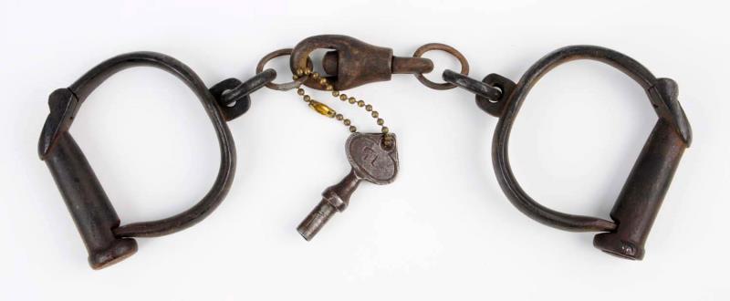 Appraisal: Froggatt Darby Handcuffs Includes key Early repair work to connecting