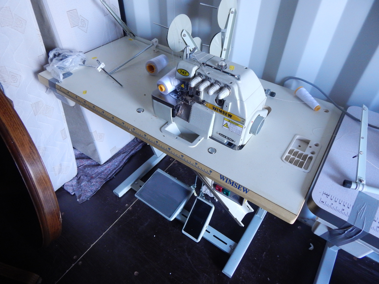 Appraisal: A Wimsew electric over locker treadle table attachments and accessories