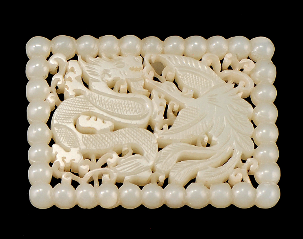 Appraisal: WHITE JADE PLAQUE th CenturyIn rectangular form With openwork dragon