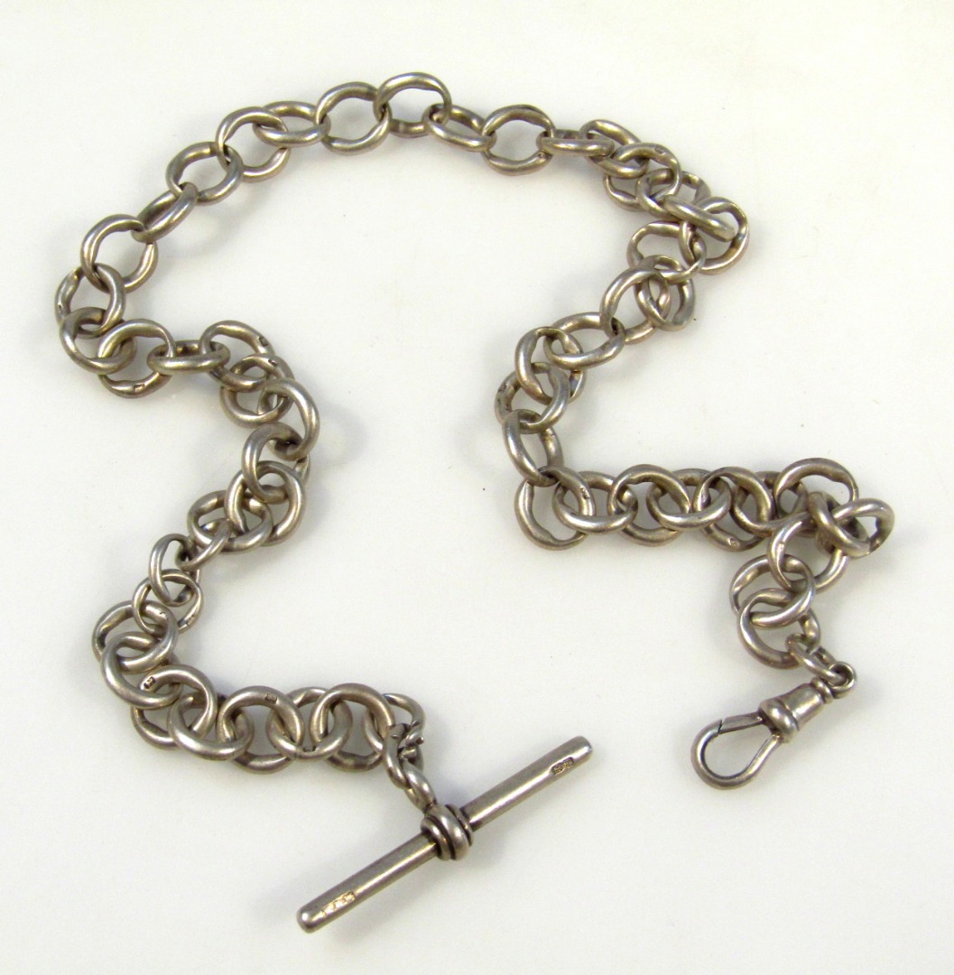 Appraisal: A silver watch chain with heavy links and T-bar end