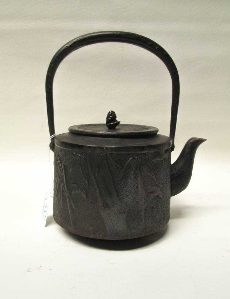 Appraisal: JAPANESE CAST IRON LIDDED TEAPOT th century with relief bird