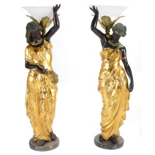 Appraisal: Arena Pair of Gilt and Patinated Bronze Figural Torchieres Massive