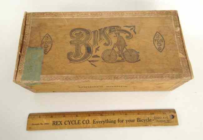 Appraisal: Early ''Bike'' cigar box and advertising ruler