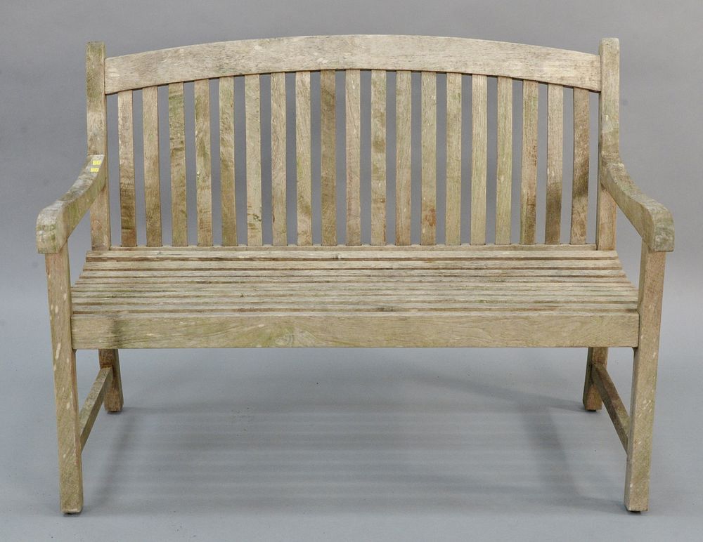 Appraisal: Teak outdoor bench having arched top Teak outdoor bench having