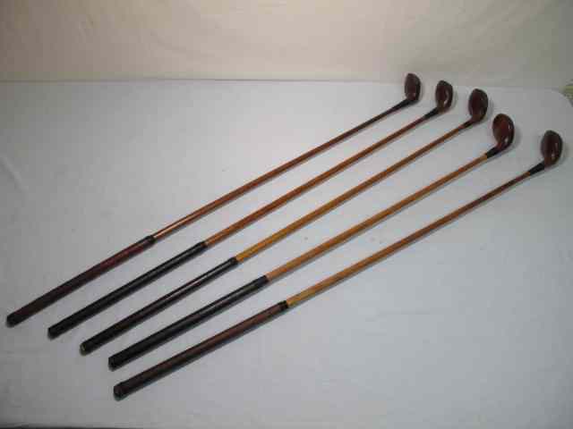 Appraisal: Lot of five assorted wood shaft golf clubs All woods