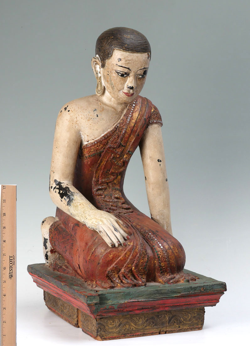 Appraisal: TH CENTURY CARVED POLYCHROME KNEELING BUDDHA Southeast Asian figure of