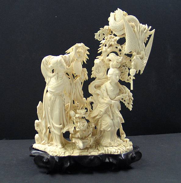 Appraisal: A pieced ivory figural carving of maidens and a phoenix