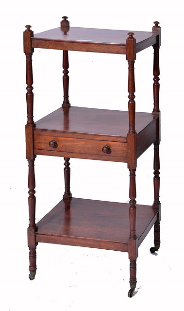 Appraisal: A REGENCY MAHOGANY THREE TIER WHATNOT with baluster turned columns