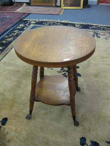 Appraisal: Oak Library Table '' Round top lower shelf iron claw