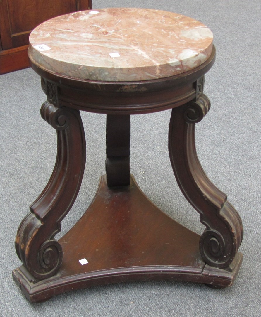 Appraisal: A th century marble top mahogany urn stand on three