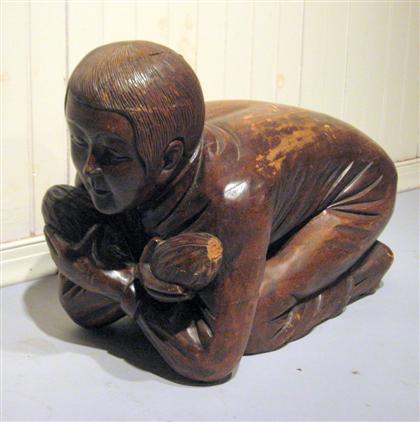 Appraisal: Chinese carved wood figure of a kneeling boy The crouched