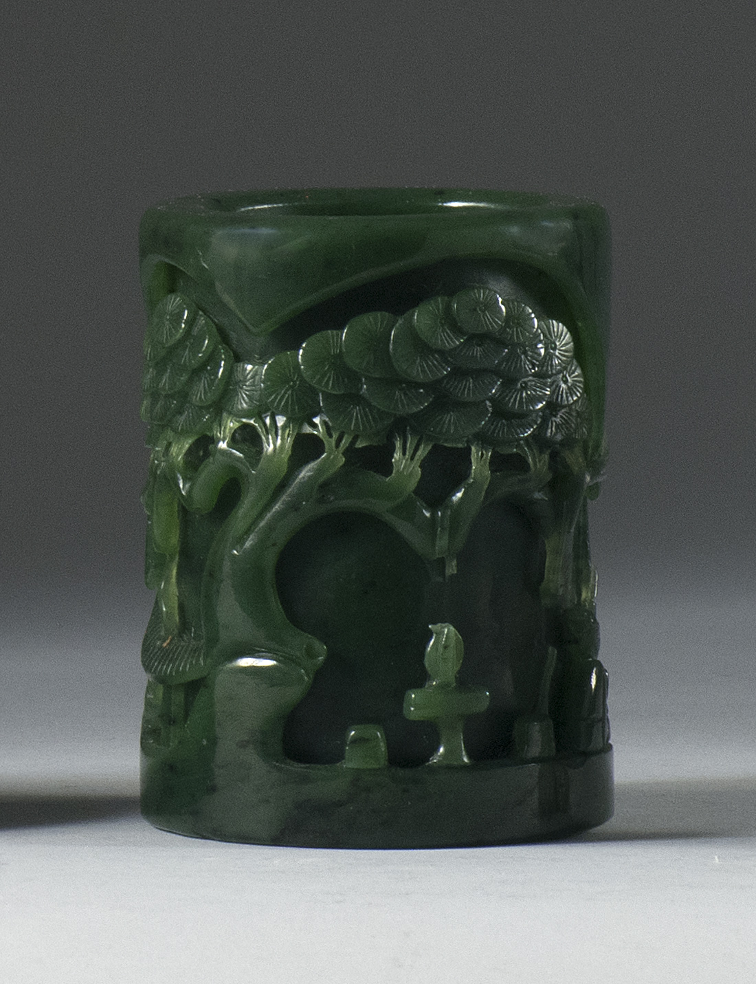 Appraisal: SPINACH-GREEN JADE BRUSH POT In cylinder form with sunken-relief carving