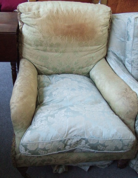 Appraisal: A near pair of deep seated Edwardian easy chairs by