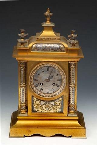 Appraisal: A FRENCH GILT BRONZE MANTEL CLOCK with circular dial and