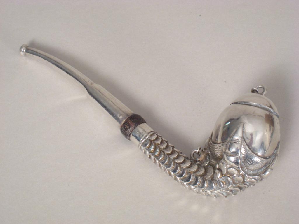 Appraisal: A white metal Pipe with claw supporting egg shape bowl