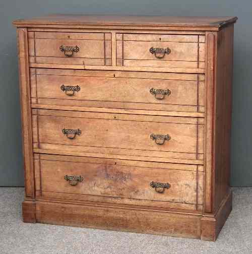 Appraisal: A late Victorian walnut chest of drawers with moulded top