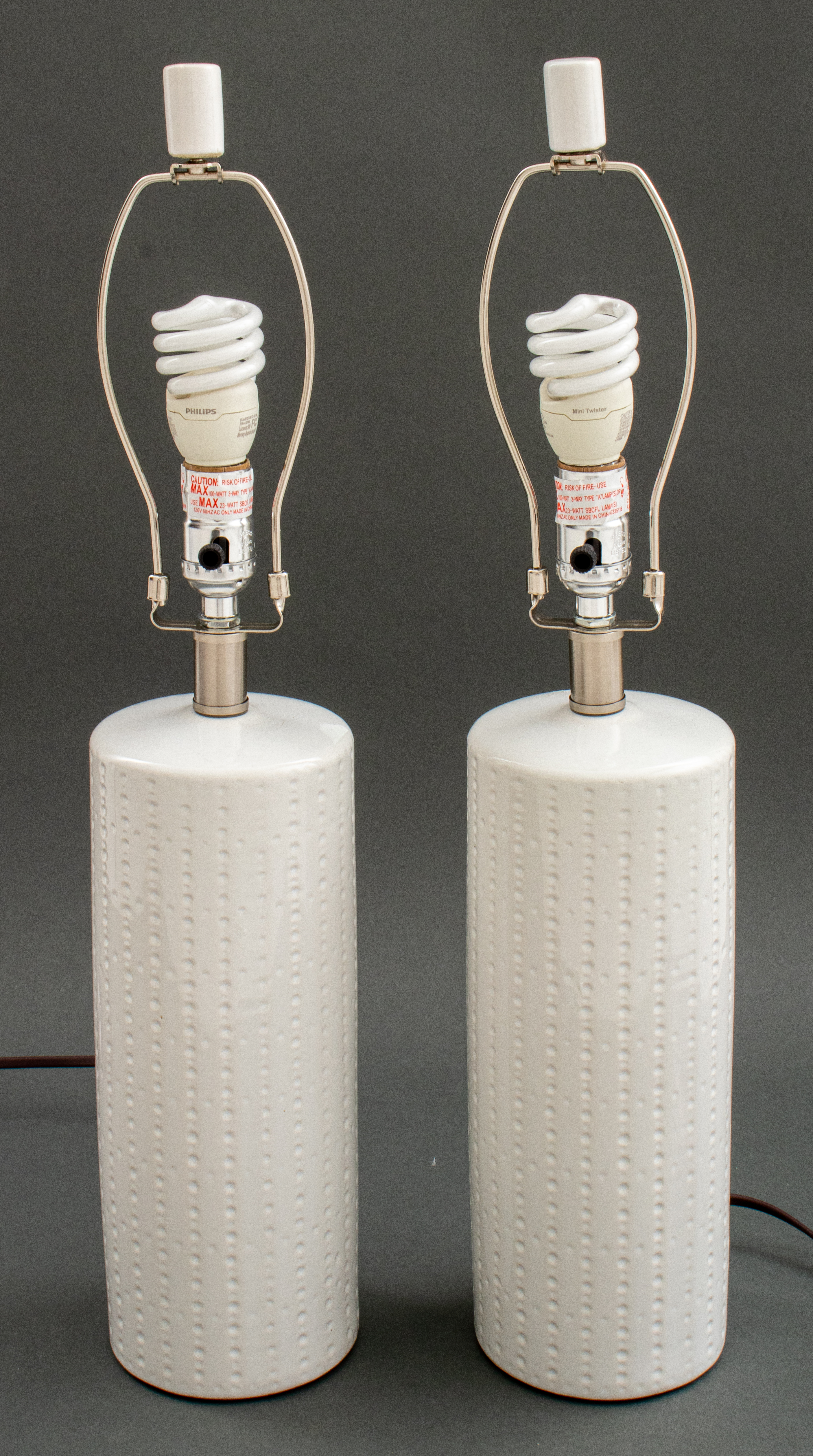 Appraisal: MOD S STYLE WHITE CERAMIC LAMPS Pair of Mod s