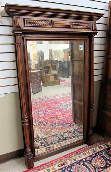 Appraisal: LOUIS XVI STYLE WALNUT FRAMED PIER MIRROR Austrian th century