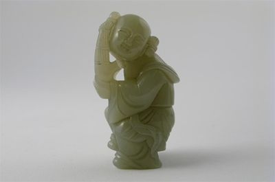 Appraisal: A Chinese pale celadon jade carving of a boy dancing