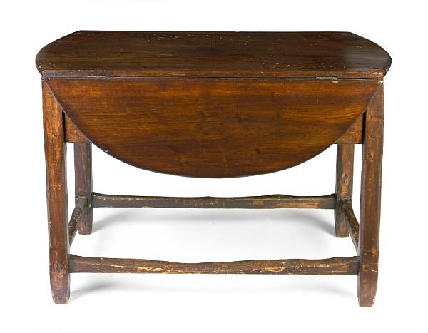 Appraisal: A Baroque style walnut drop leaf work table height in