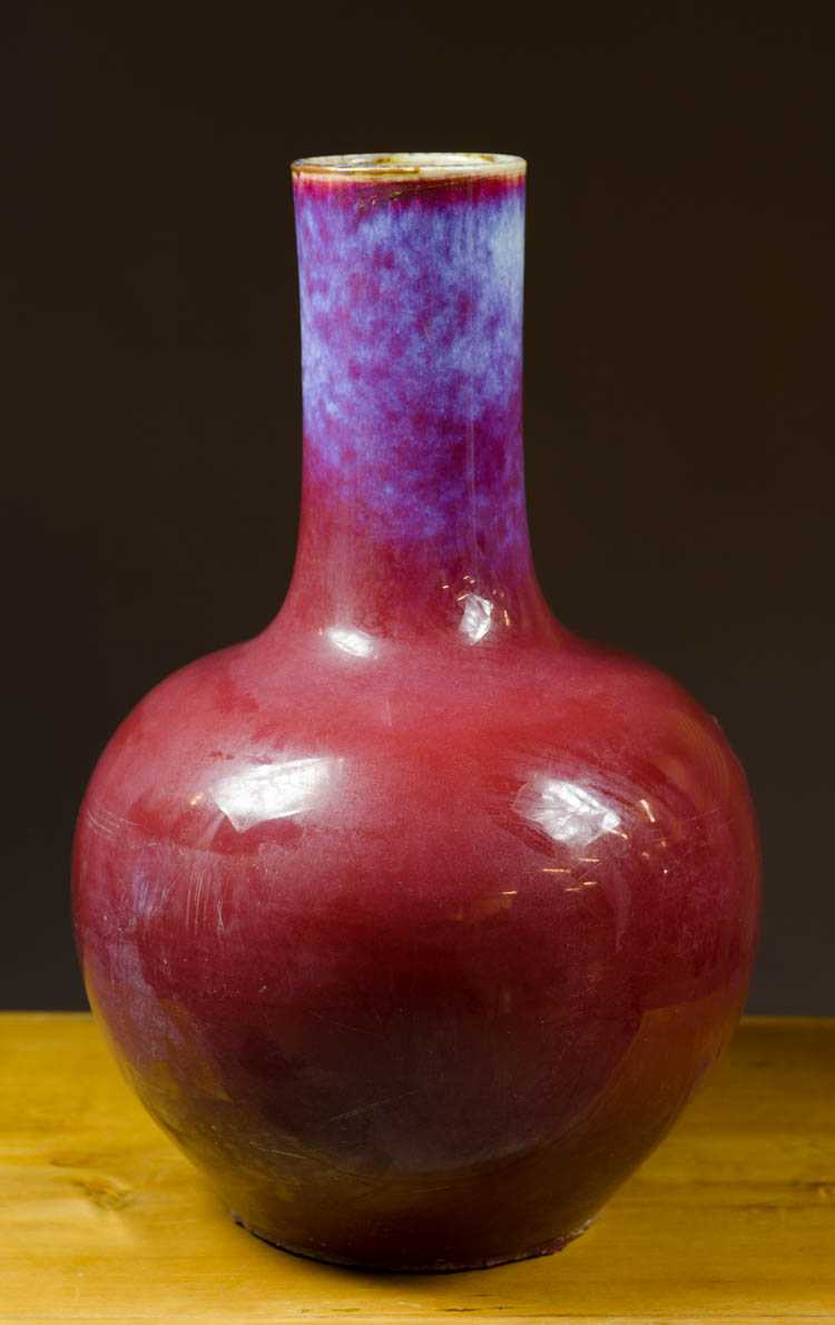 Appraisal: CHINESE FLAMBE GLAZED PORCELAIN VASE bottle form Height inches