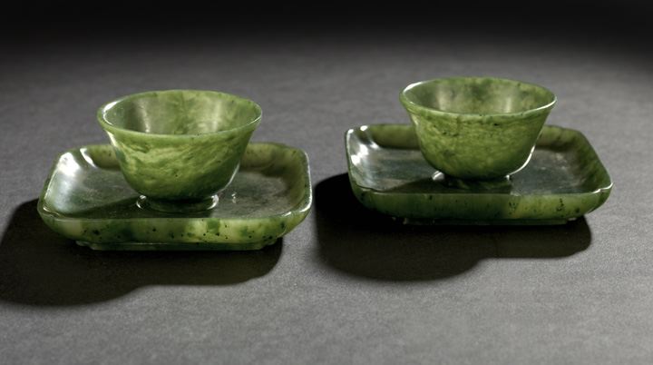 Appraisal: Pair of Chinese Carved Spinach Jade Wine Cups and Saucers