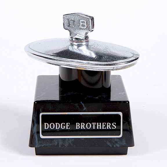 Appraisal: Dodge Brothers Hood Ornament Mascot A chrome oval chaped Dodge