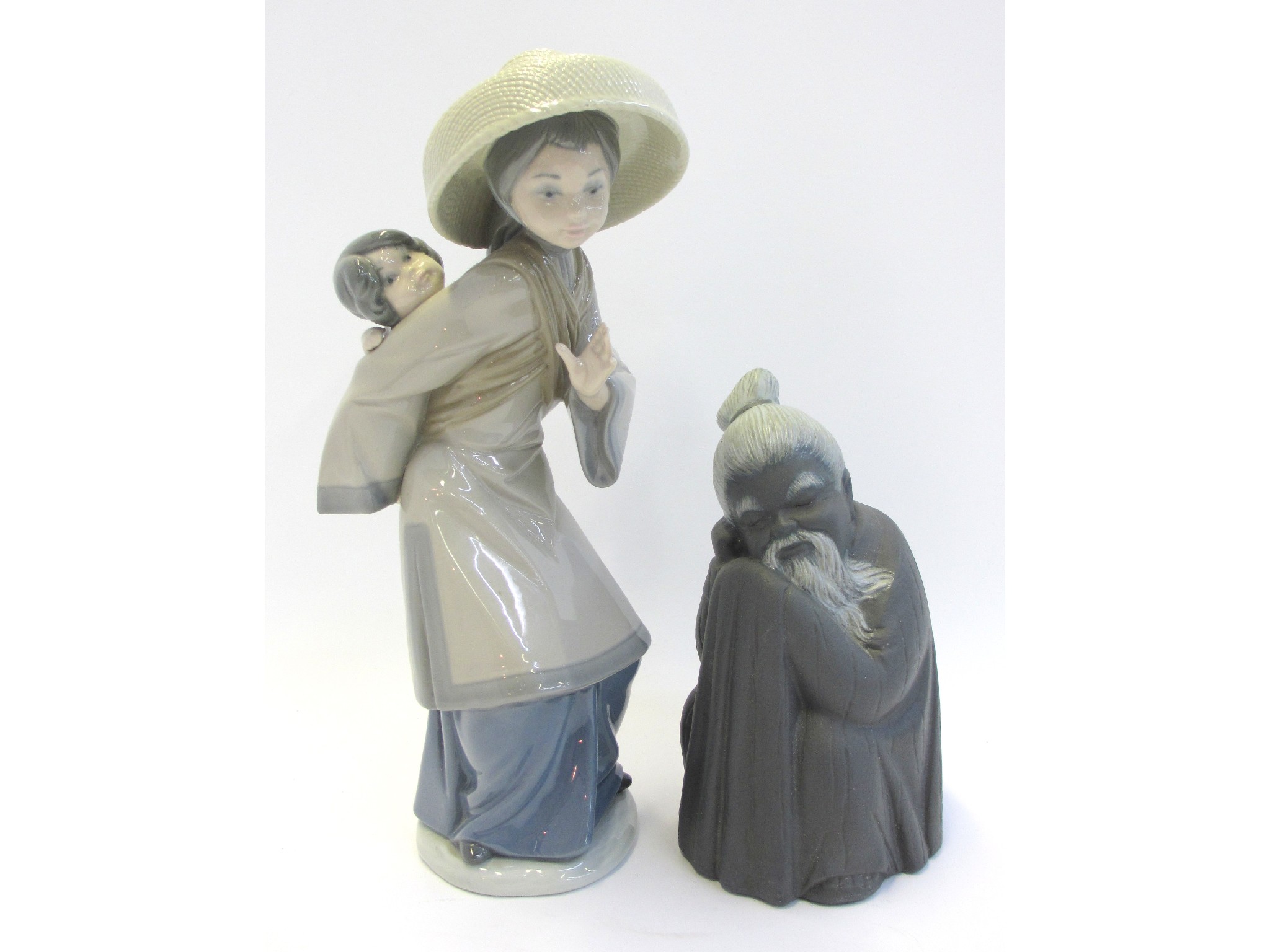 Appraisal: Lladro figure of an Asian woman carrying a child on