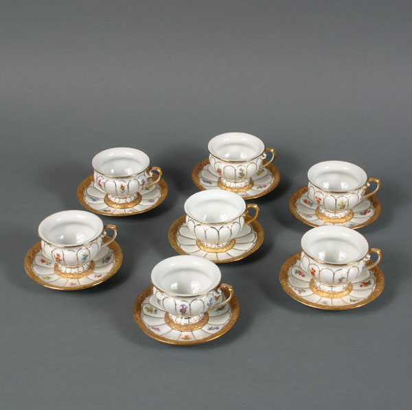 Appraisal: Meissen porcelain cups and saucers with extensive gilt and floral