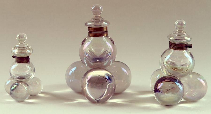 Appraisal: COLLECTION OF THREE HARRACH GLASS BALL INK WELLS A collection