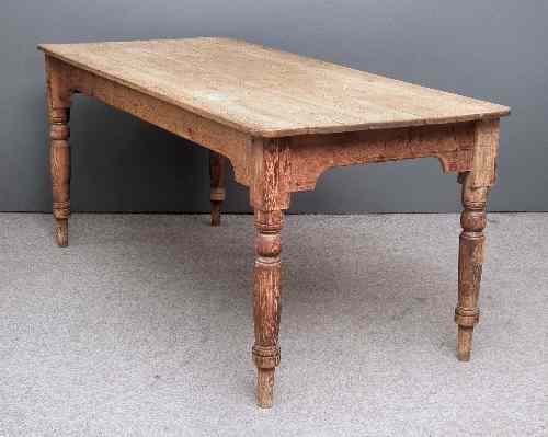 Appraisal: A th Century stripped pine kitchen table with five plank