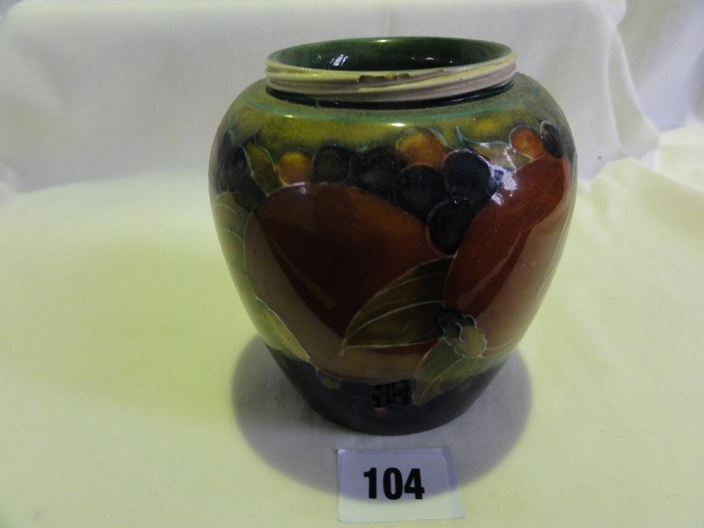 Appraisal: A Moorcroft vase with raised and painted pomegranate and grape