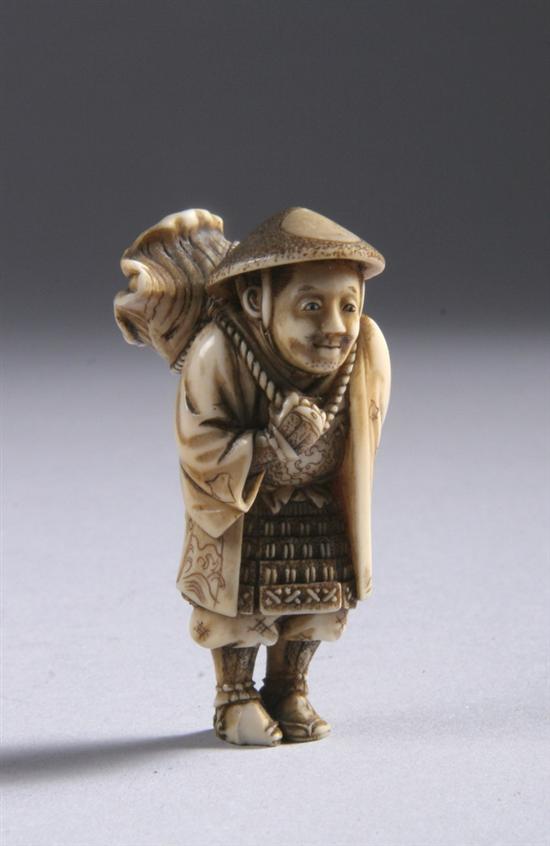 Appraisal: JAPANESE IVORY NETSUKE OF A MAN Carved to depict a