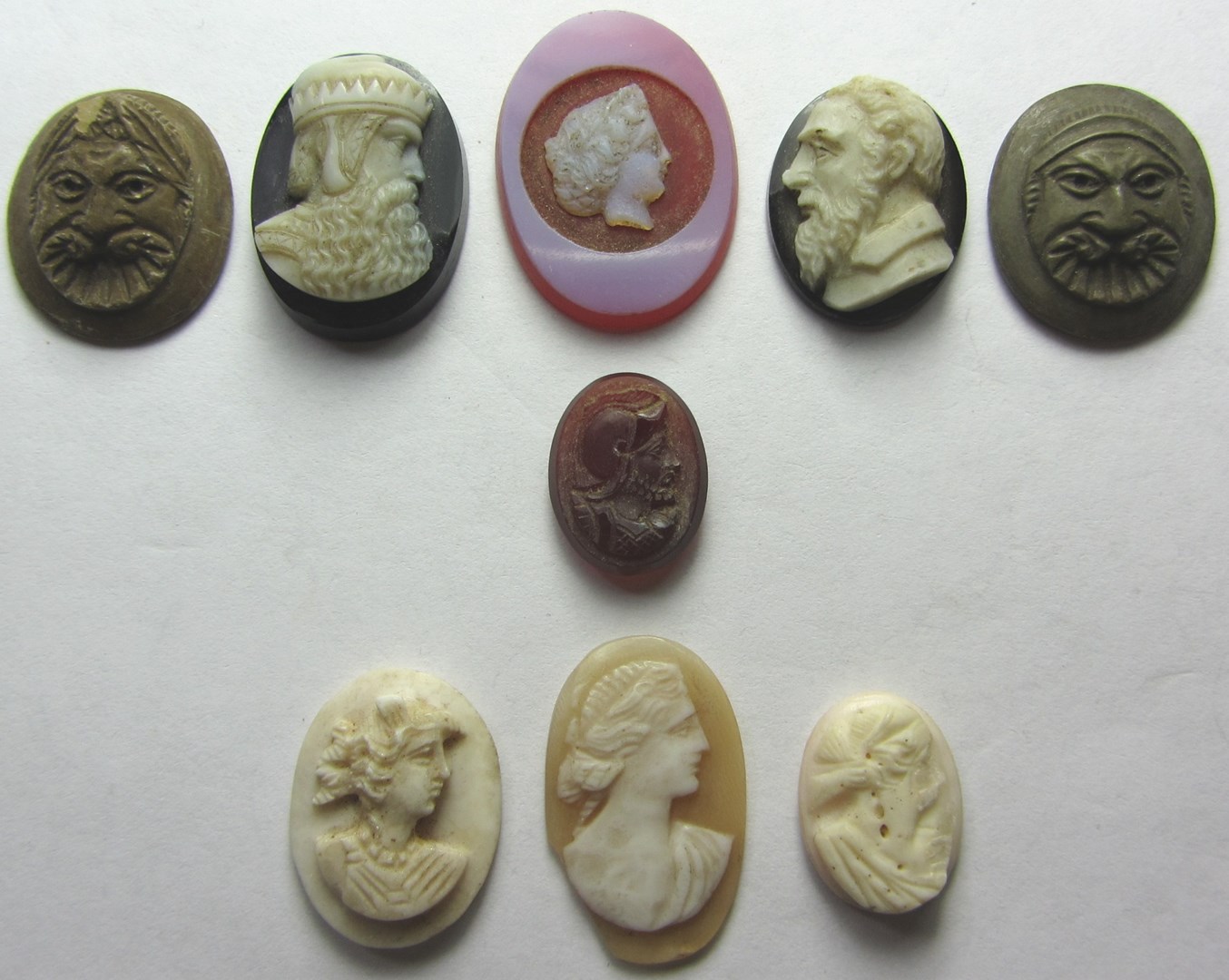 Appraisal: Two unmounted carved banded agate cameos designed as portraits of