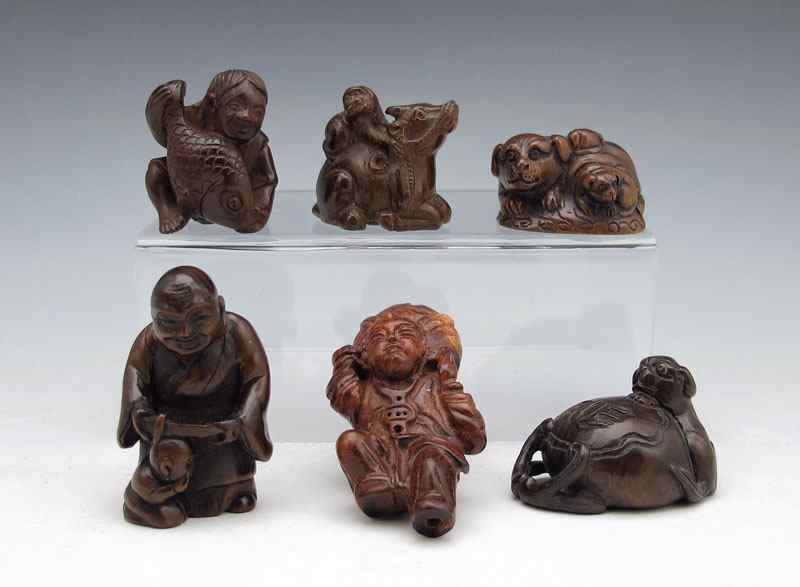 Appraisal: COLLECTION OF CARVED WOOD NETSUKE To include Dog with money