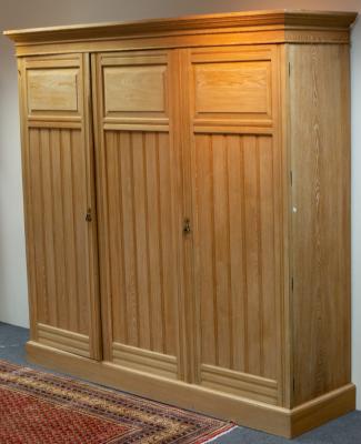 Appraisal: An Arts Crafts bleached pine triple wardrobe cm wide x