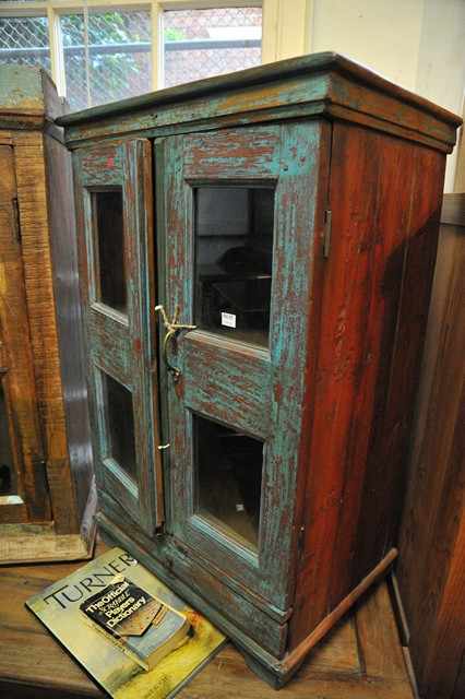 Appraisal: A RUSTIC STYLE CUPBOARD WITH GLAZED DOORS