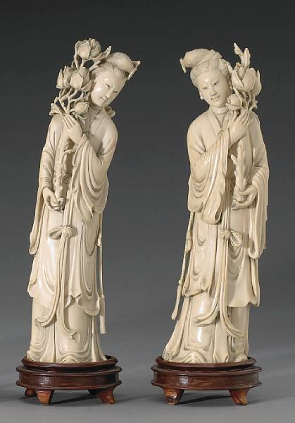 Appraisal: A pair of carved ivory beauties th Century Each standing