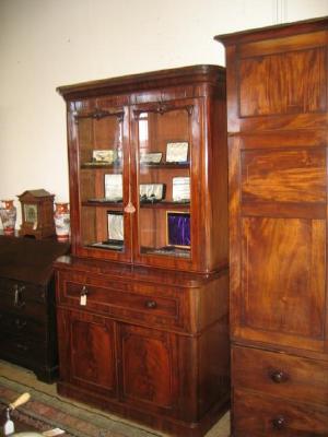 Appraisal: A VICTORIAN MAHOGANY SECRETAIRE BOOKCASE the moulded cornice over two