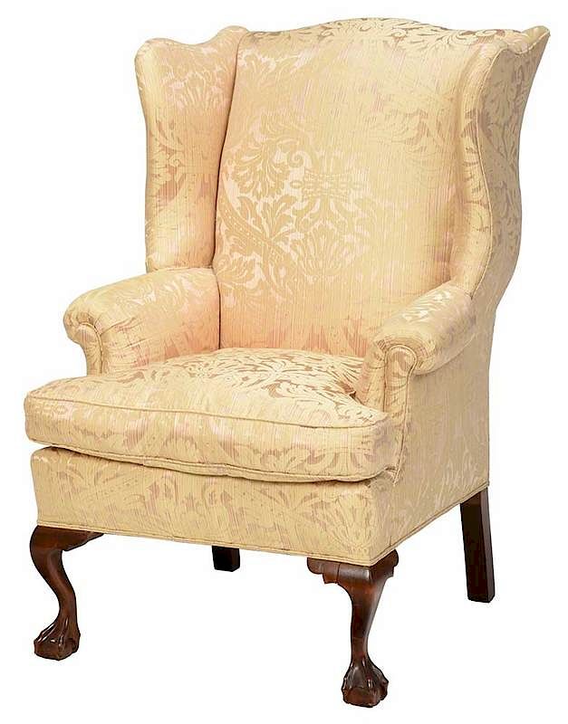 Appraisal: Chippendale Style Mahogany Wing Chair th century carved ball and