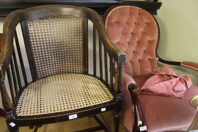 Appraisal: AN EDWARDIAN BEECHWOOD ARMCHAIR with cane seat and back tapering