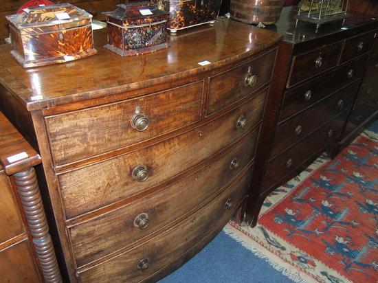 Appraisal: A late Georgian mahogany bow front chest of two short