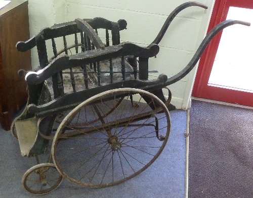 Appraisal: A late th Century twin pram with black painted body