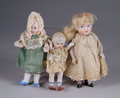 Appraisal: THREE MINI BISQUE-JOINTED DOLLS German one with blonde wig Other