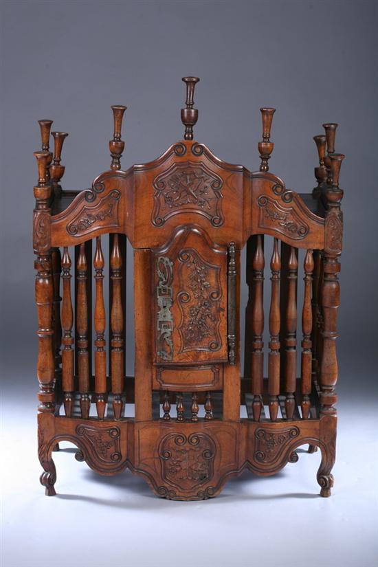 Appraisal: FRENCH PROVINCIAL CARVED FRUITWOOD PANETIERE th century Serpentine shaped crest