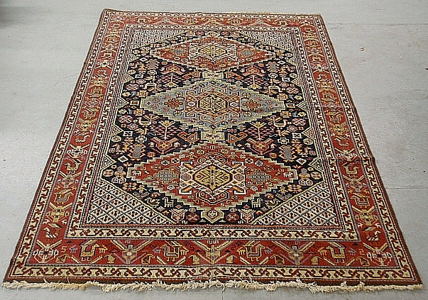 Appraisal: - Colorful oriental center hall carpet with three geometric medallions