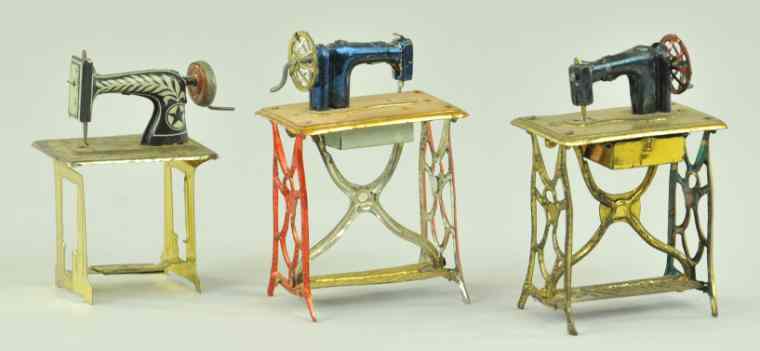 Appraisal: SEWING MACHINE PENNY TOYS Blue painted tin sewing machine together