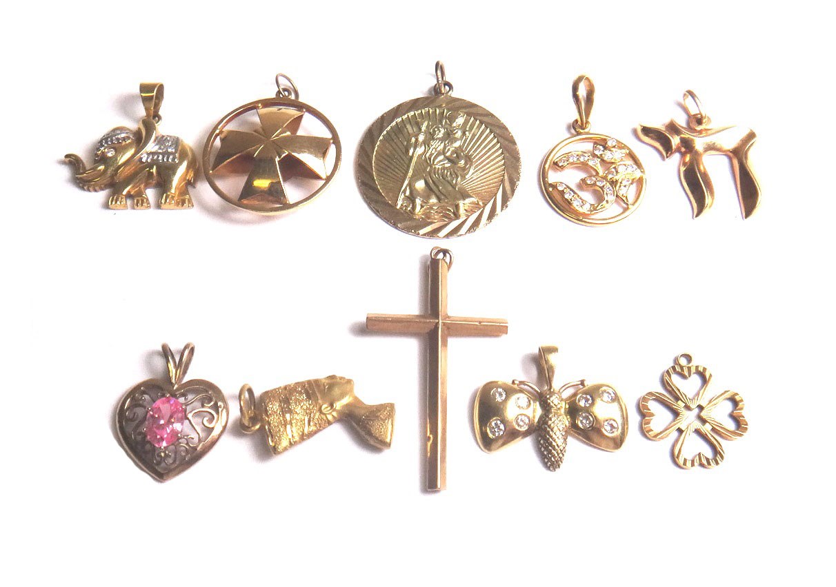 Appraisal: A group of ten mostly gold pendants and charms including