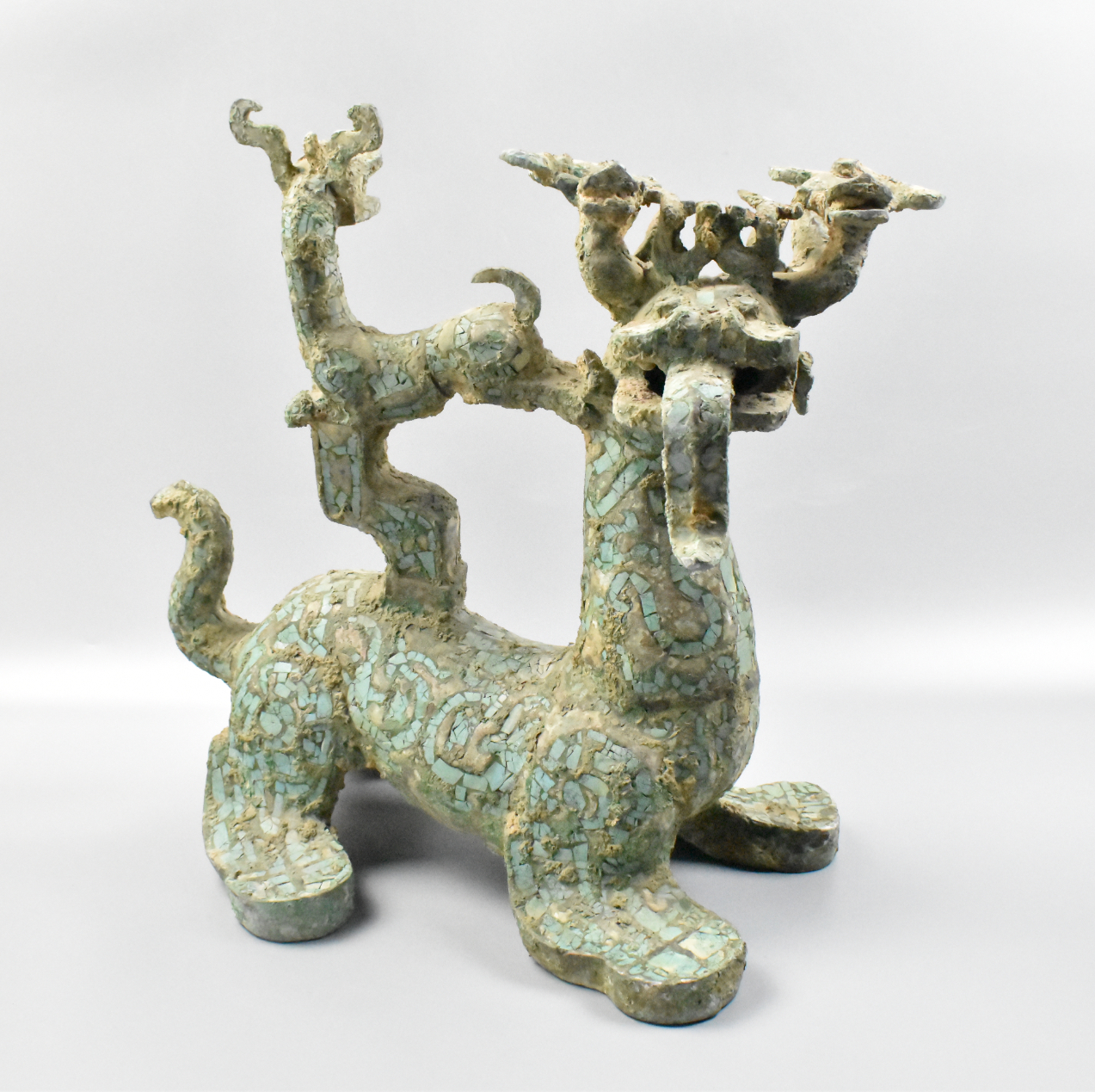 Appraisal: Chinese Archaistic beast figure with stone inlaid carrying a smaller